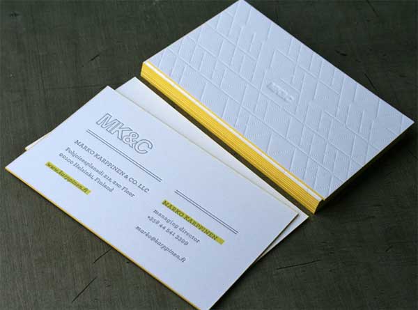 white letterpress with embossed patterns business card